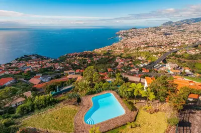an aerial view of a villa with a swimming pool at FLH Funchal Ocean View with Pool in Funchal