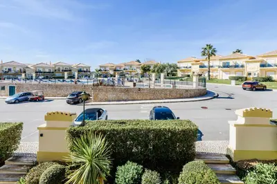 a parking lot with cars parked in a parking lot at Boavista Golf Resort- Fairviews Villa in Lagos