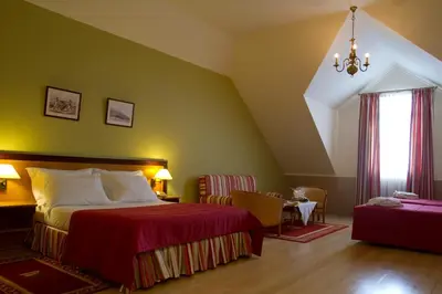 a hotel room with a bed and a window at Hotel Quinta Bela S Tiago in Funchal