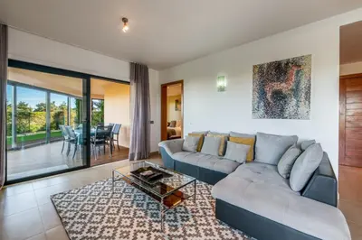 a living room with a couch and a table at Mar da Luz Resort in Luz