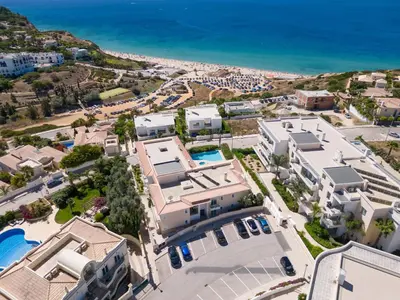 an aerial view of a city with buildings and the ocean at Porto de Mós 72 by Destination Algarve in Lagos