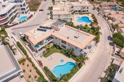 an aerial view of a house with a swimming pool at Porto de Mós 72 by Destination Algarve in Lagos