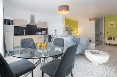 a dining room with a glass table and chairs at The Little Nest by LovelyStay in Ponta do Sol