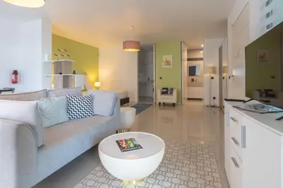 a living room with a couch and a table at The Little Nest by LovelyStay in Ponta do Sol