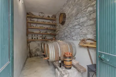a room with a bunch of wine barrels in a cellar at Casa D`Avó Celina in Funchal