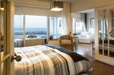 a bedroom with a bed and a view of the ocean at Apartment W Stunning View - MARINA - Free Parking & AC in Funchal