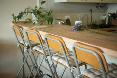 a kitchen counter with a row of bar stools at Apartment W Stunning View - MARINA - Free Parking & AC in Funchal