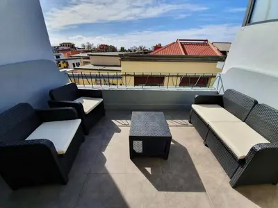 a balcony with couches and a table on a building at Agnelo Comfort - Accommodation H V in Funchal
