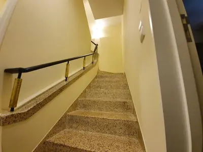 a staircase in a building with a stair railing at Agnelo Comfort - Accommodation H V in Funchal