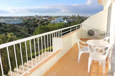 a balcony with a table and chairs and a view at Lagos 61 in Lagos