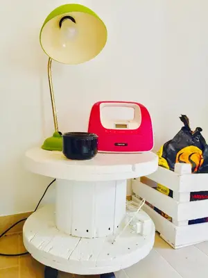 a table with a lamp and a toaster on it at CASA BIKAS in Barão de São Miguel