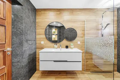 a bathroom with a sink and a mirror at Cumbres Villa in Funchal