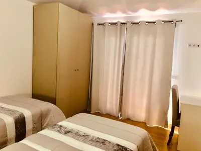 a room with two beds in a room at Villa da Bisa with heated swiming pool in Arco da Calheta