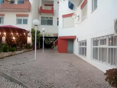 an empty street in front of a building at Cantinho Das Estrelas, Luz Lagos in Luz