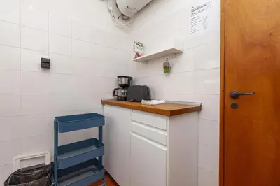 a kitchen with a counter with a coffee maker on it at Calheta House in Luz in Luz