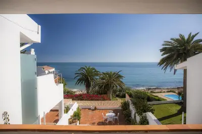 a view of the ocean from a building at Calheta House in Luz in Luz