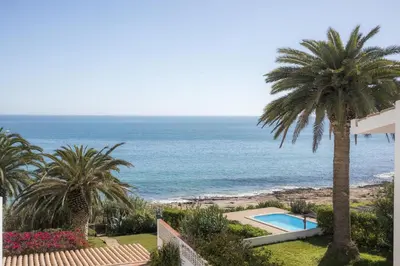 a view of the ocean from the balcony of a house at Calheta House in Luz in Luz