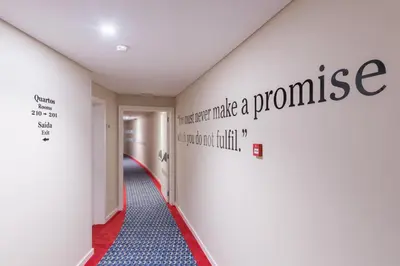 a hallway with a pharmacy sign on the wall at Pestana Churchill Bay in Câmara de Lobos