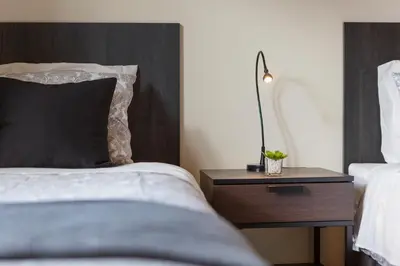 a bedroom with a bed and a nightstand with a pillow at Villa Vista Mar in Funchal