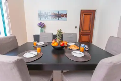 a black table with a bowl of fruit on it at Villa Vista Mar in Funchal
