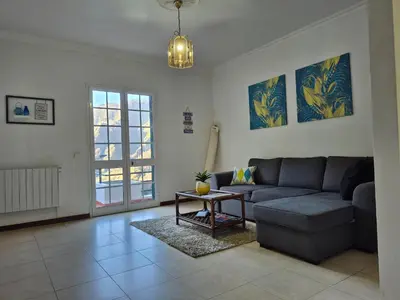 a living room with a couch and a table at Valley of Nuns Holiday Apartments in Curral das Freiras