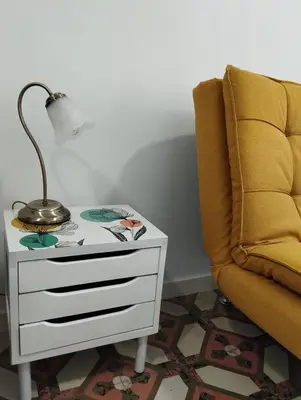 a lamp on a table next to a chair at Apartamento Burgo 