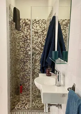 a bathroom with a sink and a shower at Apartamento Burgo 