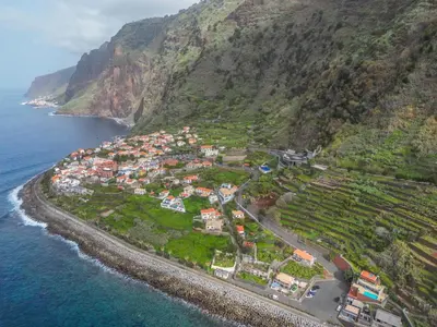 an aerial view of a village on the side of a mountain at Recanto Jardim Do Mar in Jardim do Mar