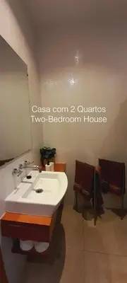 a bathroom with a shower and a sink and a toilet at First Balcony - Porto Santo in Porto Santo