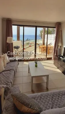 a bathroom with a white sink and a mirror at First Balcony - Porto Santo in Porto Santo