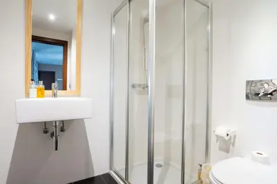a bathroom with a shower and a sink and a toilet at Villa Ocean Sight by LovelyStay in Funchal