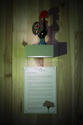 a sign on a table with a vase on it at Machim House by AnaLodges in Machico