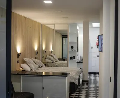 a bedroom with a bed and a large mirror at Machim House by AnaLodges in Machico