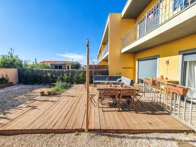 a wooden deck in front of a house at Casa Mawi in Sagres
