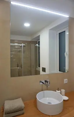 a bathroom with a white sink and a mirror at Superior Rentals - Downtown Villa in Funchal