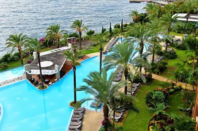 an aerial view of the pool at the resort at Pestana Promenade Ocean Resort Hotel in Funchal