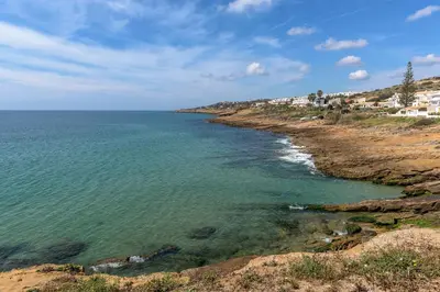 a view of the ocean from a cliff at FLH Praia da Luz Apartment with Balcony in Luz