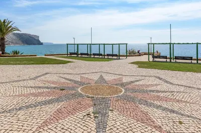 a star mosaic on a sidewalk near the ocean at FLH Praia da Luz Apartment with Balcony in Luz