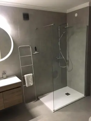 a shower with a glass door in a bathroom at Lagos Beach 59A in Lagos