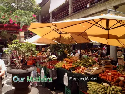 an outdoor market with fruits and vegetables on display at OurMadeira - Heart of Old Town II in Funchal