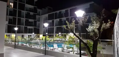 a hotel with a swimming pool at night at Madalenas Palace - Sunrise in Funchal