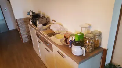 a kitchen with a counter top with a counter top at Abrigo das Nortadas in Vila do Bispo