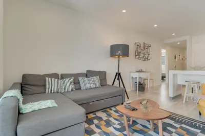 a living room with a couch and a table at Braganza apartment in Funchal