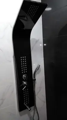 a black shower with a hair dryer on a counter at Vista Atlântico in Gaula
