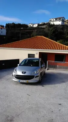 a silver car parked in front of a building at Vista Atlântico in Gaula