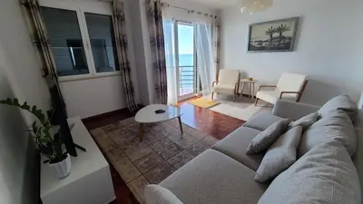 a living room with a couch and a table at The Best Atlantic Ocean View in Câmara de Lobos