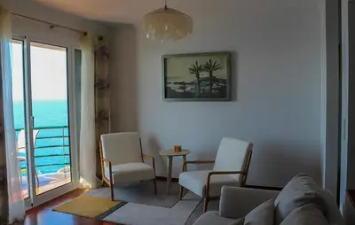 a living room with a view of the ocean at The Best Atlantic Ocean View in Câmara de Lobos