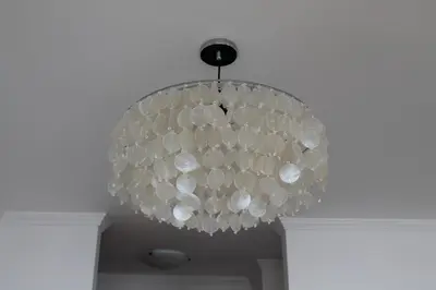 a large glass chandelier hanging from a ceiling at The Best Atlantic Ocean View in Câmara de Lobos