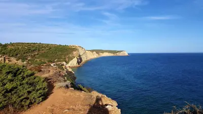 a view of the ocean from a cliff at Lovely Burgau villa just 3 mins walk from beach in Budens