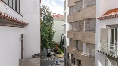 a view of an alley between two buildings at Central Funchal Apartment - GARDEN - Free Parking & AC in Funchal